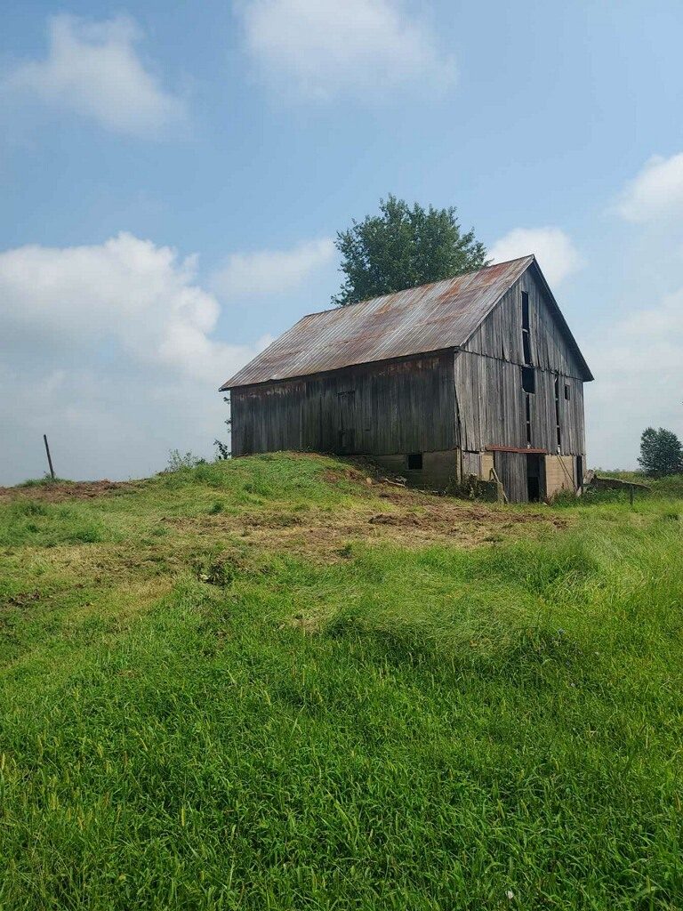 Old weathered barn before demo and site clearing work in Northern Indiana