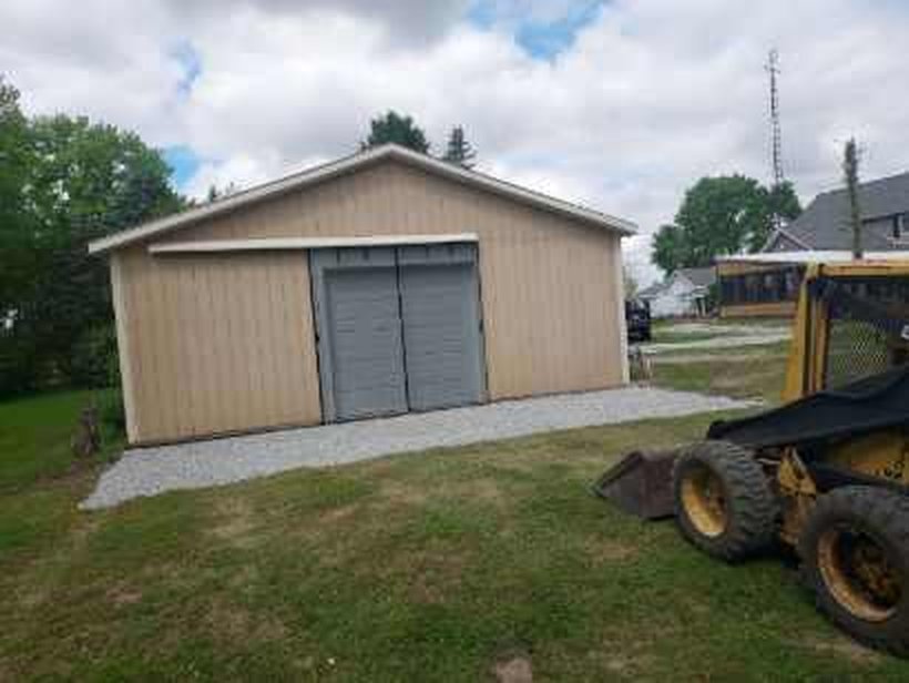 Completed gravel pad installation beside garage in Knox Indiana