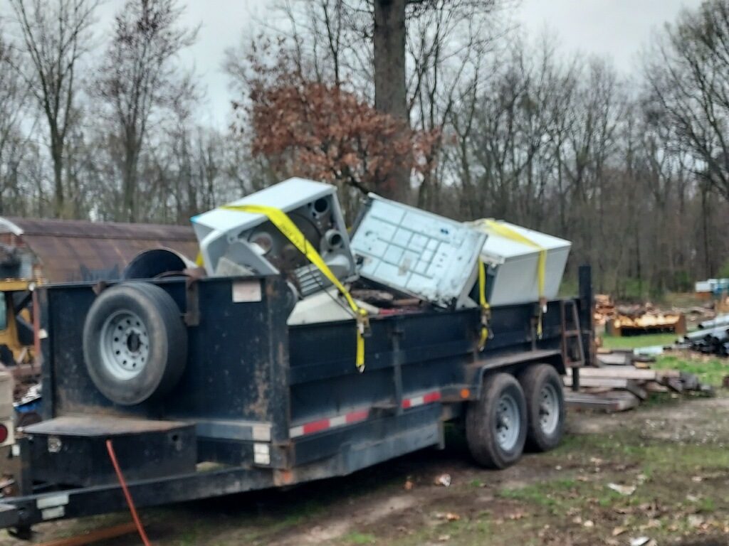 Old appliances and scrap loaded on dump trailer for removal in Knox Indiana