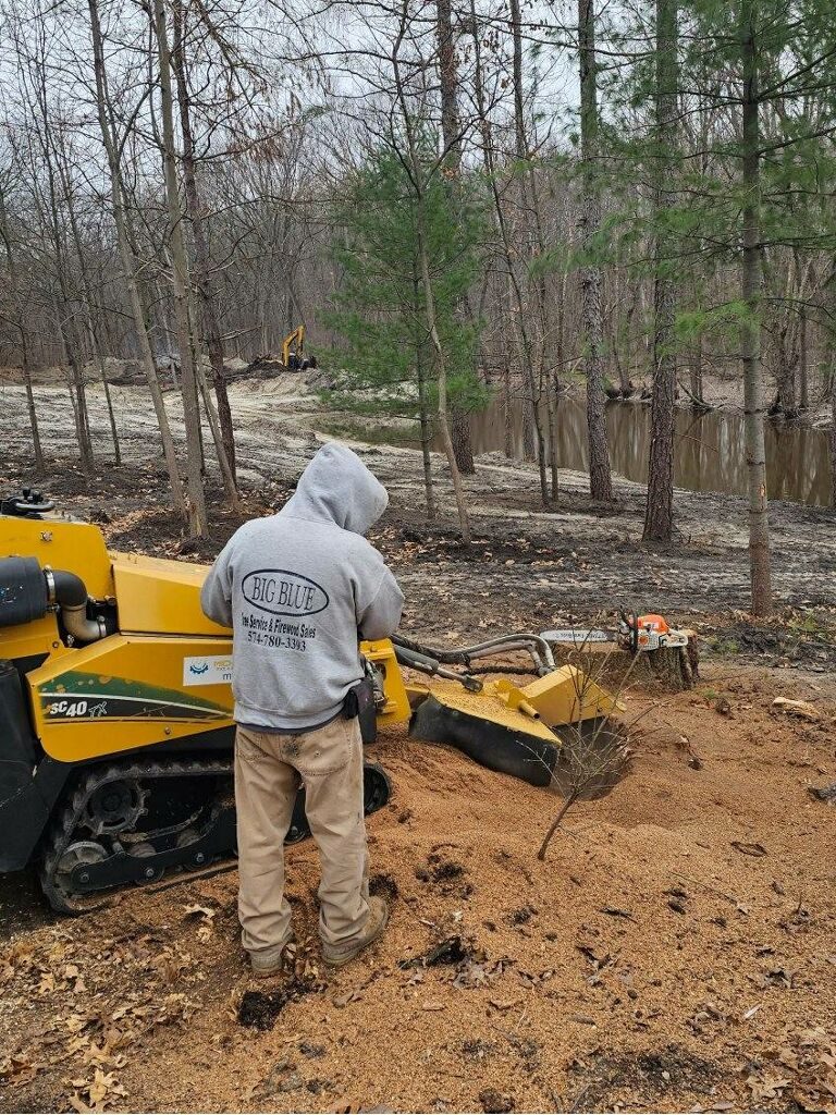 Ray Heater operating SC40 stump grinder at pond site in Northern Indiana